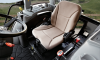 AIR SEAT - An ergonomically designed, fully adjustable suspension seat in cab models allows the operator to ride in comfort no matter what the task may be.