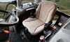 AIR SEAT - An ergonomically designed, fully adjustable suspension seat in cab models allows the operator to ride in comfort no matter what the task may be.